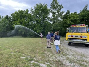 Reed tests out the hose